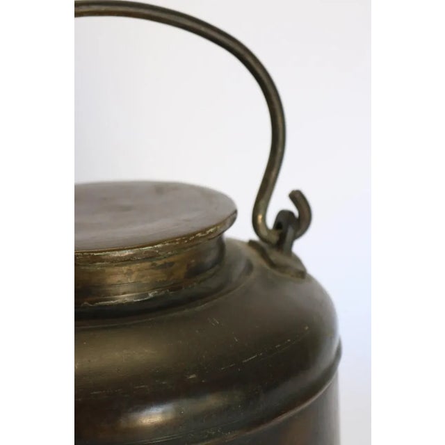 Brass water container with handle, from India. 1910