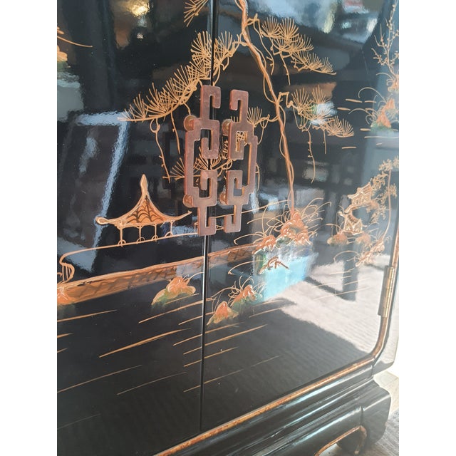 The Japanese Slant Front Cabinet has the feel of an antique with its rustic lacquer finish. Handpainted with a Japanese...