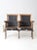 Here are a pair of antique American theatre seats circa early 20th century. The cast iron and wooden bench chairs feature...