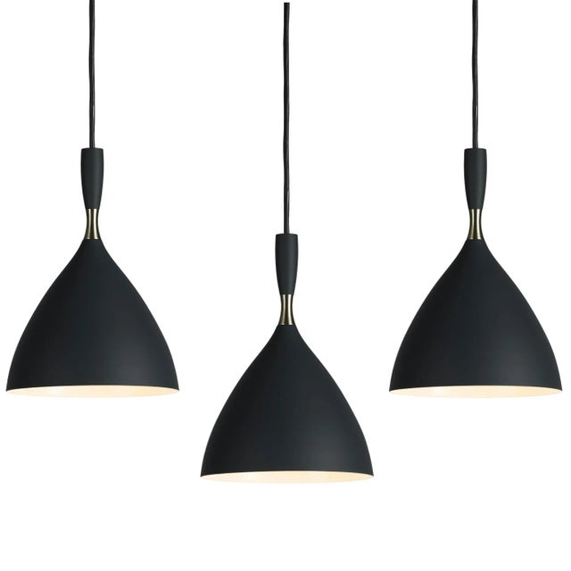 Birger Dahl pendants in the style of Stilnovo. Architectural pendant lights designed circa 1954 and executed in black...