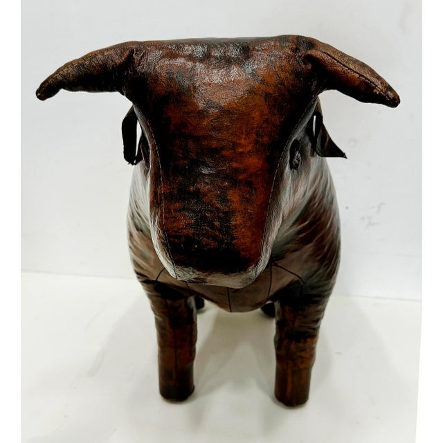 Mid-century Dimitri Omersa for Valenti Home Bull Ottoman Offered for sale is a vintage cowhide-leather bull ottoman or...