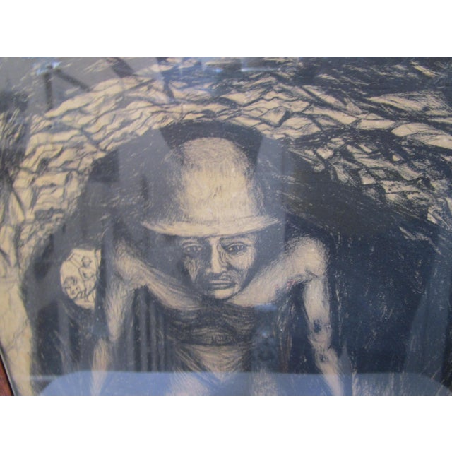 A miner emerges from the shadows of a tunnel in this lithograph by Francisco Mora. He looks overworked and tired. This...