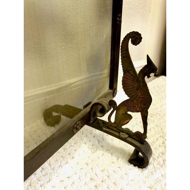 This single-panel fire screen represents a classic example of decorative yet functional hearth accessories. Constructed...