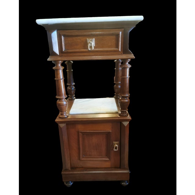 Set of two beautiful antique nightstands. these night stands are over 100 years old. they are made in good noble wood as...