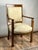 This elegant antique French fauteuil reflects the restrained sophistication of the Directoire period, with clean...