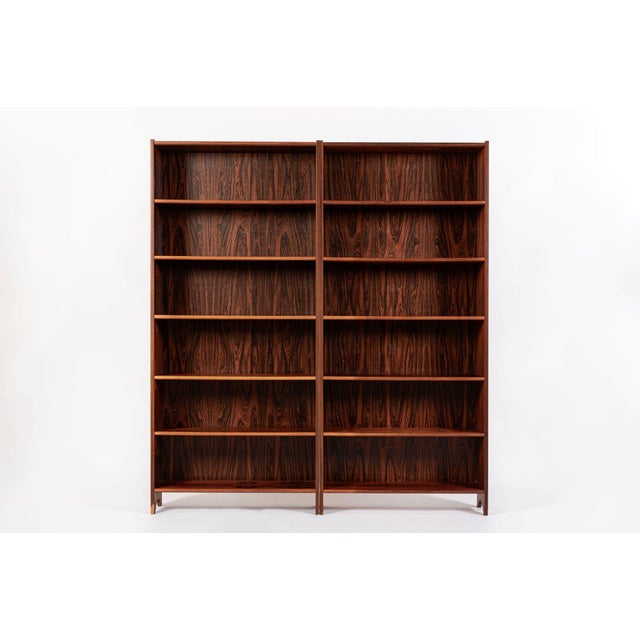 This exceptional pair of vintage mid century Swedish modern rosewood bookcases was made in Sweden circa 1960. The...