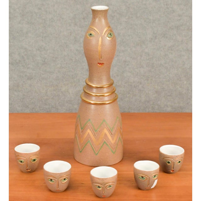 A circa late 1950’s Aldo Londi Italian stoneware sake set, created for the Bitossi Company. The Cups are decorated with...