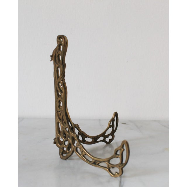 Vintage brass filigree easel tabletop picture or plate holder. No makers mark. Minor age wear.