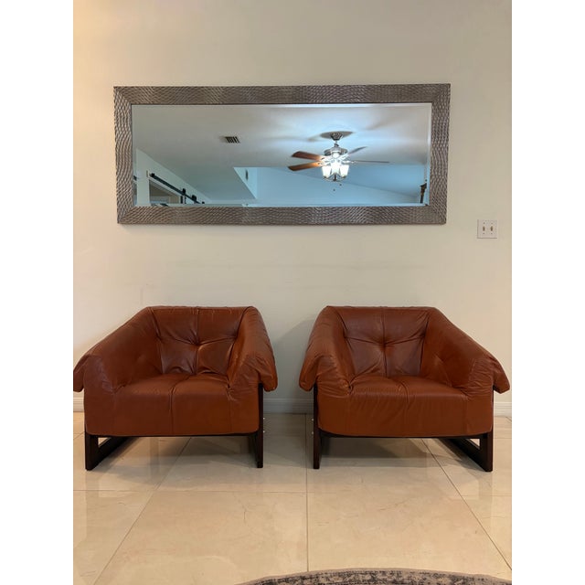 An extraordinary pair of original Percival Lafer MP-97 lounge armchairs. These sculptural chairs feature Lafer's renowned...