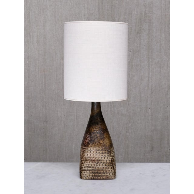 This very rare table lamp was designed by Stig Lindberg and produced by the Studiohanden workshop at Gustavsberg in Sweden...