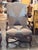 Pair of walnut armchairs carved with scrolling accents along the arms and apron, shown clearly in the detail image. The...