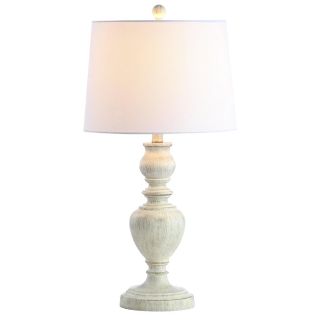 A modern classic, this table lamp blends traditional style with the look of relaxed luxury. it's timeless urn body is...