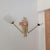 A very beautiful and substantial wall sconce in the style of Arlus or Lunel. 1960s. Brass and copper frame. It features...