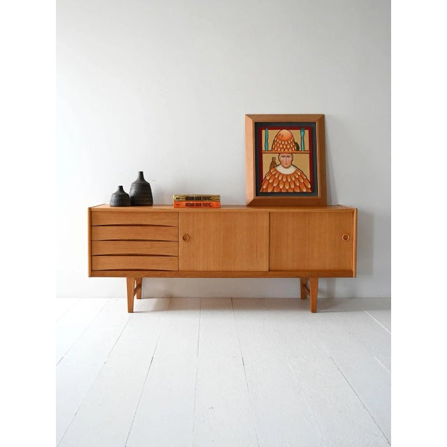 Swedish sideboard, model "Ulvo," designed by Erik Wørts for IKEA in the early 1960s. Made of light oak, it features two...