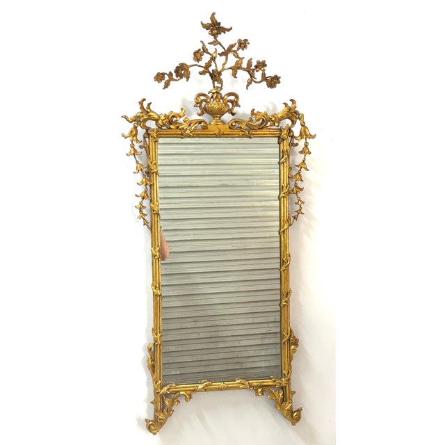 Italian Neoclassical Carved Giltwood Mirror Italy, late 18th century This elegant Italian Neoclassical giltwood mirror...