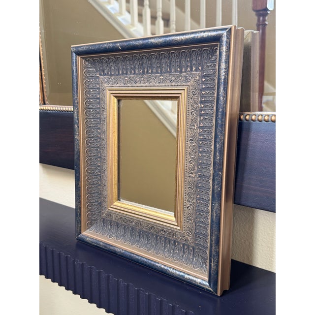 The vintage Baroque inspired style solid wood frame is in a gold and black distressed finish. The inner frame has a...