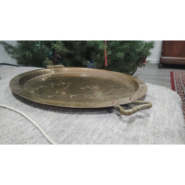 Presented is an exceptional Imperial Russian hammered brass samovar tray, produced in Moscow during the late 19th to early...