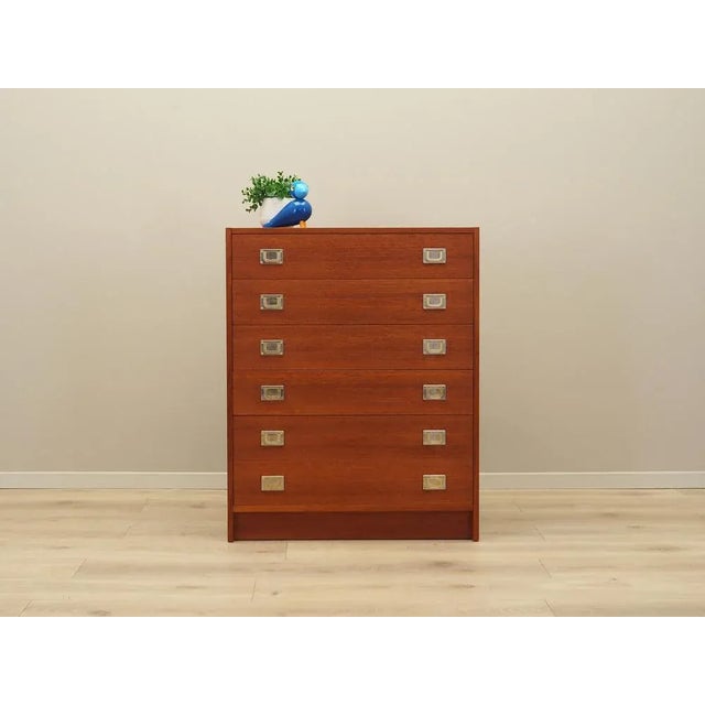The chest of drawers was made in the 1960s, Danish production. The structure is covered with teak veneer. The furniture...