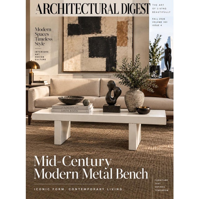 A pair of minimalist backless benches featuring rectangular slab tops supported by thick pillar legs in a matching white...