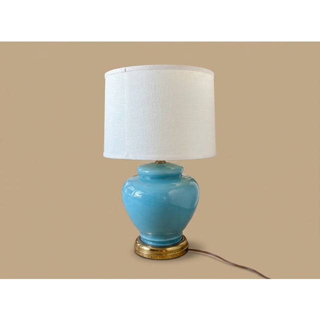 Bring classic Mid-Century elegance to your space with this stunning 1950s cased-glass bulbous table lamp. Featuring a...
