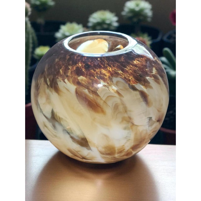 This vintage Italian hand-blown art glass vase features a beautiful amber tan brown color, adding a touch of elegance to...