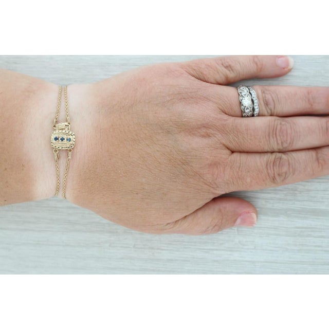Gemstone Information: - Natural Sapphires - Total Carats - 0.12ctw Cut - Round Color - Dark Blue Treatment - Heated Metal:...