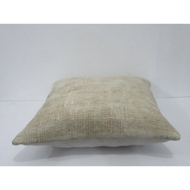 Decorative pillow cover made from a vintage Turkish handknotted rug. Backed with good quality cotton fabric. Pillow...