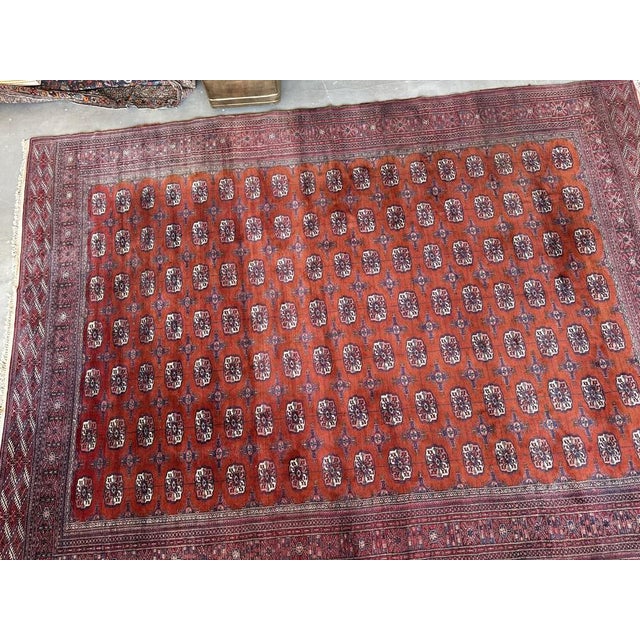 Beautiful large handwoven wool Bokhara wool rug from Turkmenistan. Stunning terracotta colourway with a touch of dark...