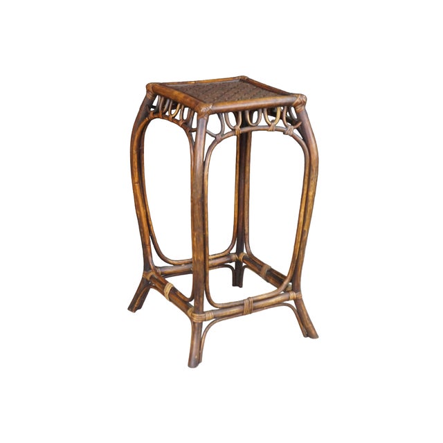 This vintage mid-century bohemian bentwood rattan and bamboo pedestal side table showcases a charming, organic...