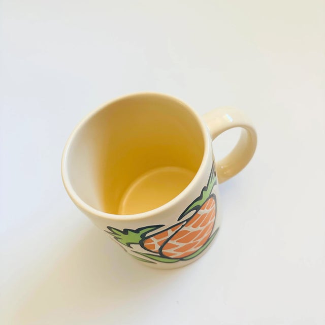 A vintage ceramic mug, made in Spain by Waechtersbach. Lovely painted pineapple designs around the sides. Marked on the base.