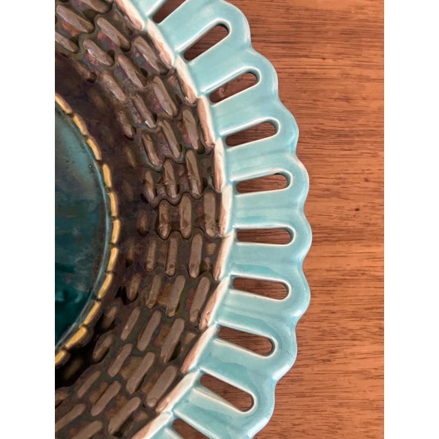 Antique majolica plate made by Wedgwood in England, date stamped to 1878. Has a reticulated edge, a basketweave pattern...
