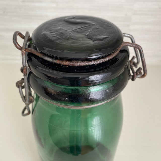 Beautiful authentic antique French La Lorraine "1 Litre" green glass canning jar with a raised thistle design on the lid...