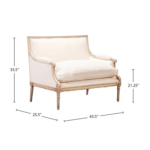 A sophisticated Louis XVI-style painted canapé attributed to the celebrated French design house Jansen, dating to...