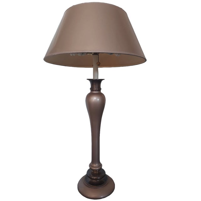 This contemporary table lamp features a metallic finish that will enhance any room with its elegant presence. Its...