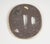 A finely crafted Japanese tsubo (handle guard) from the Edo period, made of bronze with gilded accents of gold and silver....