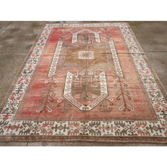 A vintage Turkish Anatolian accent carpet handmade during the Mid-20th century. Measures: 7' 0" x 9' 9"
