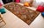 Dimension: 53" x 126" Excluding fringe Material :The original rug is made of wool on wool. Brown, Gray, white and black...