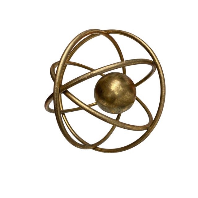 Three gold metal armillary style decorative spheres with center balls. The largest is 10" diameter. Great condition with...