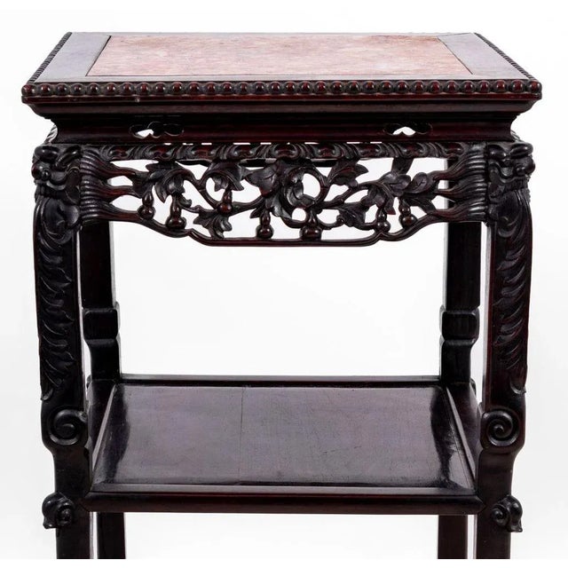 Chinese Carved Hardwood and Marble Two Tier Pedestal Table, late 19th century, the square inset top above a carved frieze,...