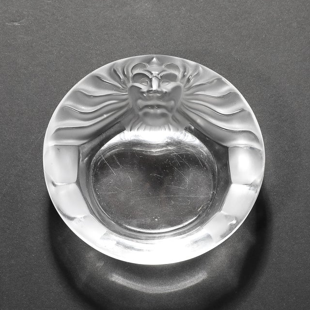 The Lalique "Tête de Lion" glass dish , crafted in France, circa 1950, is a stunning example of the artistry and...