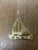 This vintage brass key hook rack, crafted in the shape of a sailboat, is a beautifully balanced blend of form and...
