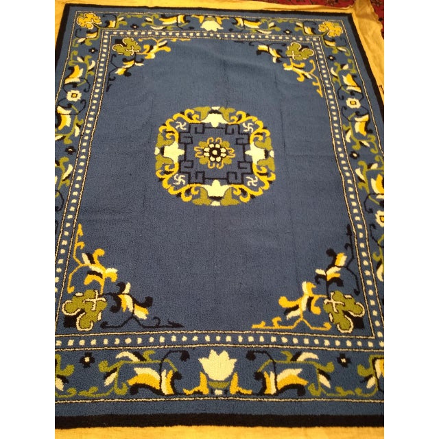 This vintage American hand-hooked rug from the second quarter of the 20th century draws its inspiration from the serene...