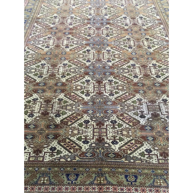 Hand knotted Turkish rug with 75% wool and 25% cotton dyed with vegetable color. This antique piece was made 1960's, and...