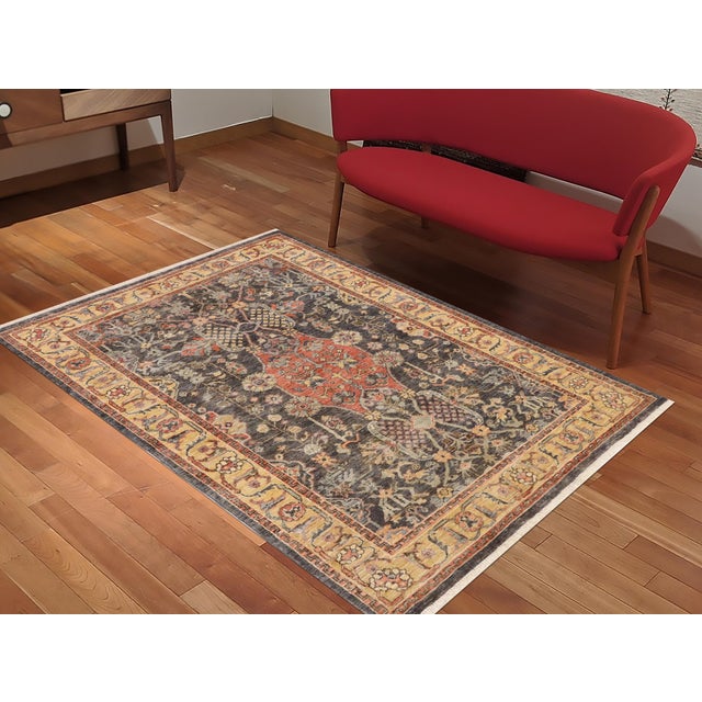 "Enhance the ambiance of your home with this magnificent Persian-influenced Turkish hand-knotted rug made by skilled...