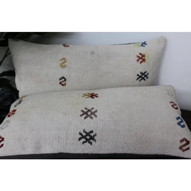 This Turkish pillow cover is made from the highest quality Vintage Kilim in 100% wool on the front. The back is covered in...