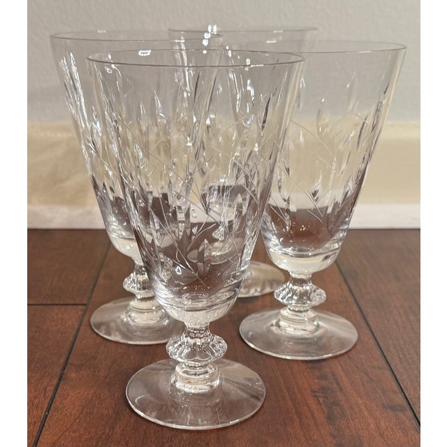 A charming set of four vintage Duncan & Miller crystal iced tea goblets in the classic Willow pattern, featuring delicate...