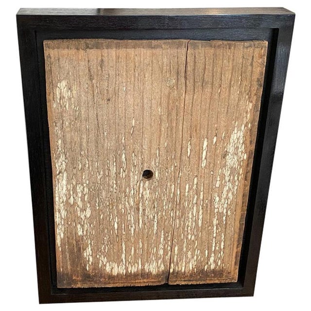 Antique hand carved panel from Toraja. Framed in a minimalist black teak wood shadow box. This carving symbolizes the...