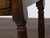 An English walnut table from the 19th century with single drawer, column-shaped legs on bun feet, plain side stretchers...