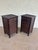 Vintage late 20th-century pair of British Colonial style nightstands or end tables featuring faux burnt bamboo frames with...