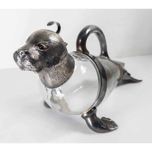 We are selling this great Victorian Silverplate wine decanter. This decanter has great novelty form of a Walrus or Seal....